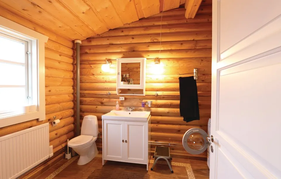 The bathroom with a washing machine