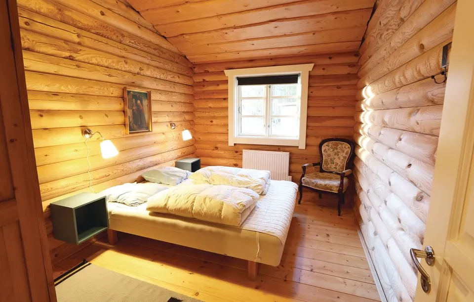 Bedroom with a double bed and armchair